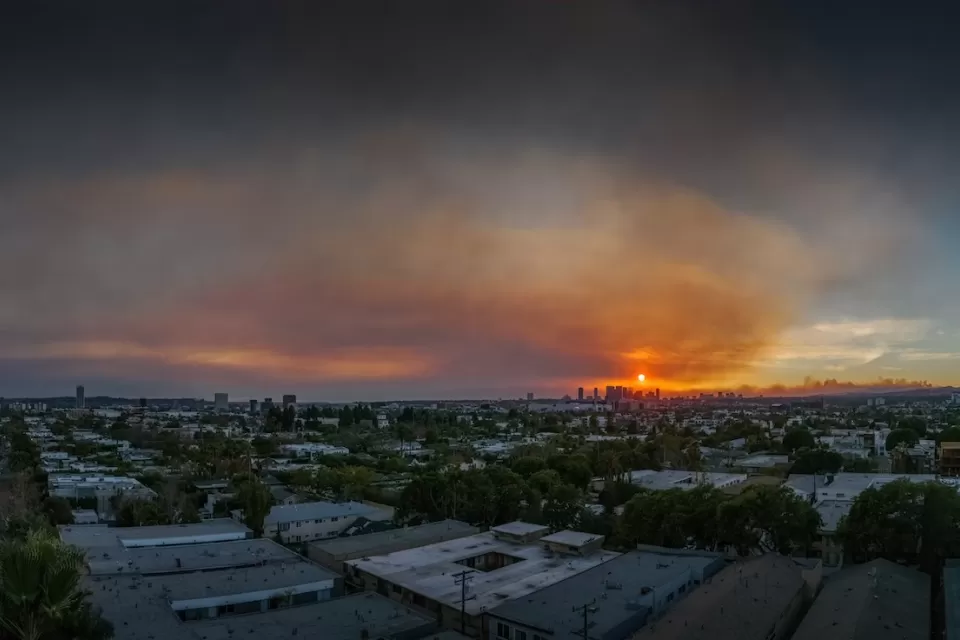 Smoky sky overlooking Los Angeles skyline during 2025 wildfires.